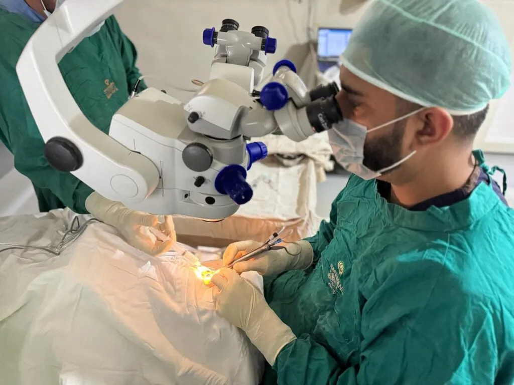 Mr Mohamed Mohyudin operating at the microscope
